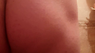 Sasha Earth washes in the bathroom and sticks a big long anal plug into his ass