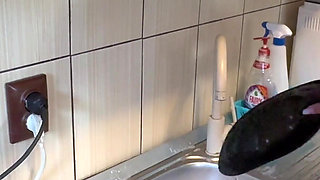 Hair Wash with Dishwasher Liquid in Kitchen Sink