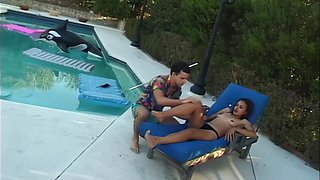 Passionate brunette delivers sensual outdoor pool pleasure with intense heat