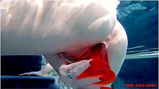 Red Xxx In Fucks Her Pussy With A Toy In The Pool
