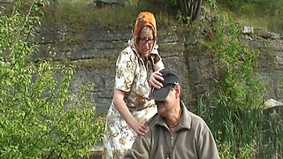 Busty Granny and Teen Pleasing a Dick Outdoors