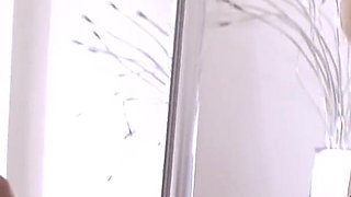 Puffy nippled girl gets naked in front of a mirror