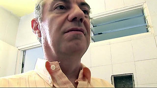 Older dude gets a blowjob in the bathroom by a younger teen