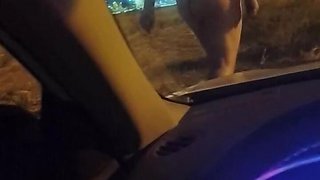 Naked outside the car
