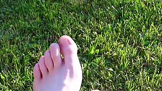 Walking with My Feet on the Grass and Showing Them to You up Close
