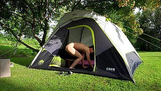 Brave teen pissing and cumming while campers drive by his tent