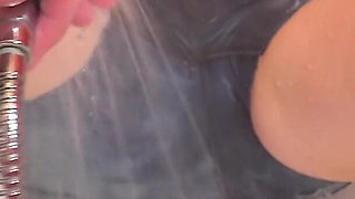 Tied in the Bathtub, the MILF Gets a Shower Stream at Her Clit While the Pussy Is Spread with Clamps