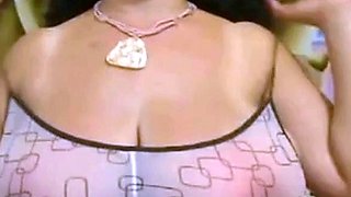 Big-Breasted Black Mature Woman Shows Off on Webcam