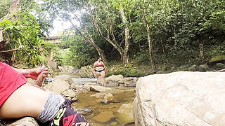 Unknown girl gives me a handjob in the river and cums on her big tits