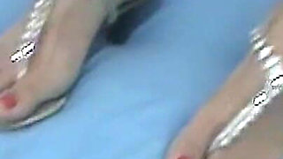 Andrea in Homemade Footjob POV