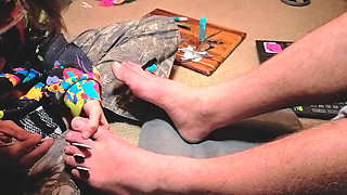 Praising her Masters' feet