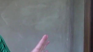 Sexy lesbian couple kiss passionately as they undress each other