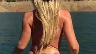 Blonde is flashing her big boobs in the outdoors