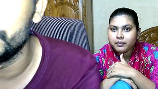 Newlywed couple and their friend getting cozy in an Indian village