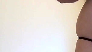 Teen lotions and rubs her tits