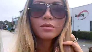 Blonde is flashing her big boobs in the outdoors