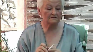 Horny Old Grandma Vera Fingers Her Unshaved Pussy Outside