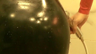 Sexy MILF in latex rubber - Shower striptease