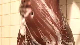 Sexy amateur chick taking a shower and masturbating