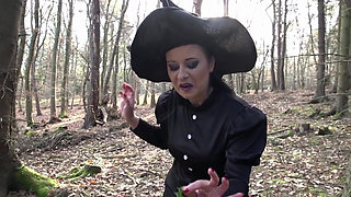 Brunette milf in a costume of a witch just been caught and fucked in the ass from a forest keeper