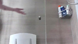 Julie splashes on glass wall