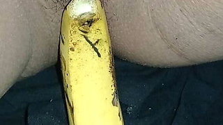 Indian girl playing with banana