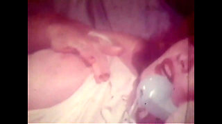 Vintage Redhead with Huge Boobs and Black Stockings Has Solo Sex in Her Bed