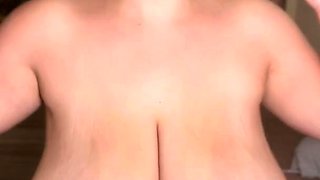 Voluptuous amateur MILF massaging her huge natural breasts